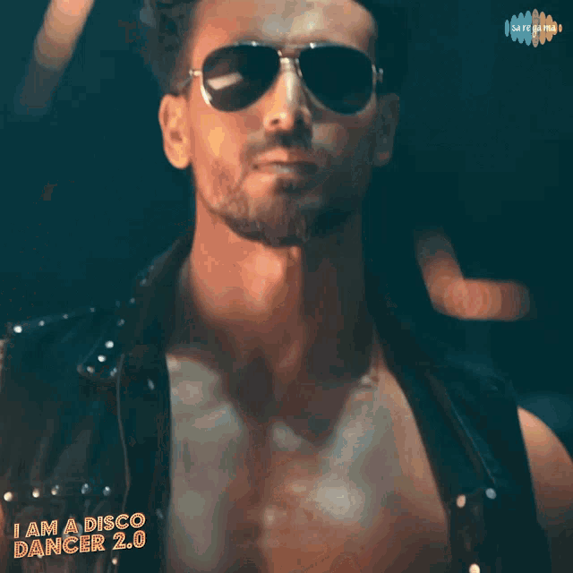a poster for a movie called i am a disco dancer 2.0 features a shirtless man wearing sunglasses
