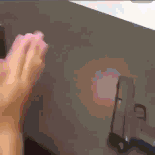 a close up of a person 's hand on a desk