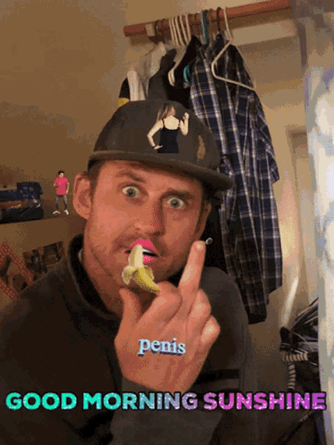 a man with a banana in his mouth and the words penis good morning sunshine above him
