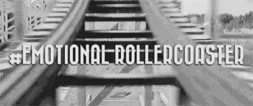 a black and white photo of a roller coaster with the words `` emotional roller coaster '' written on the bottom .