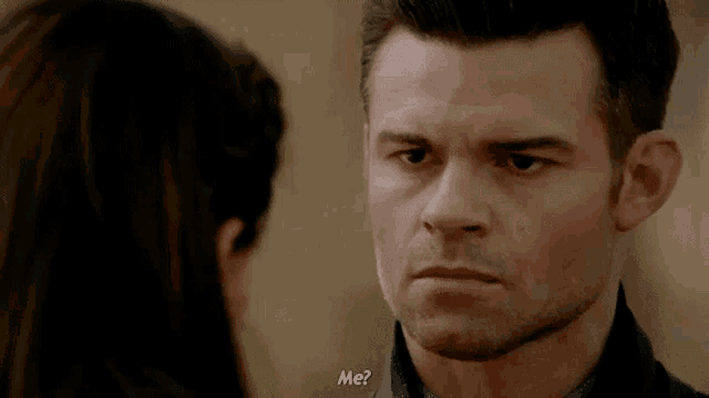 a man and a woman are looking at each other and the woman is asking the man if he is me .