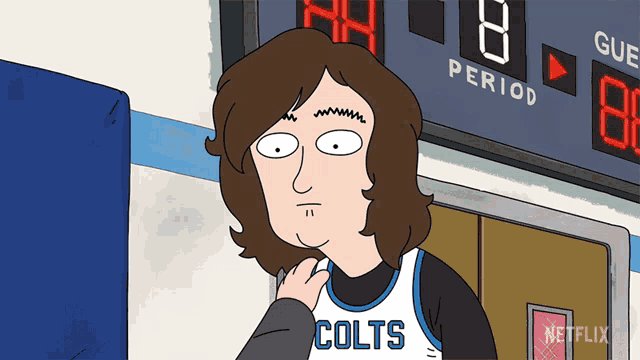 a cartoon character wearing a colts jersey is standing in front of a scoreboard