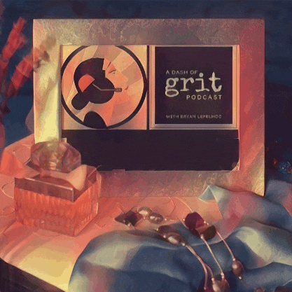 a dash of grit podcast sits on a table next to a bottle of perfume