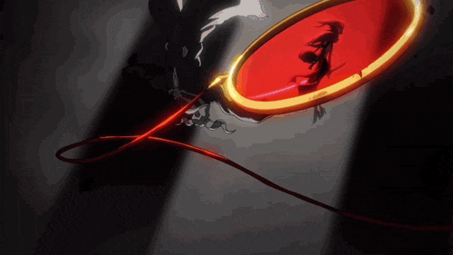 a shadow of a person is cast on a red circle
