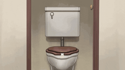 a toilet in a bathroom with a skull on the lid