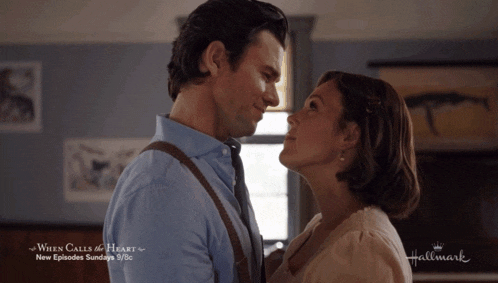 a man and woman are looking into each other 's eyes with the words when calls the heart on the bottom