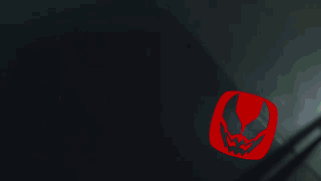 a red circle with a few icons on it including one that says ' s ' on it