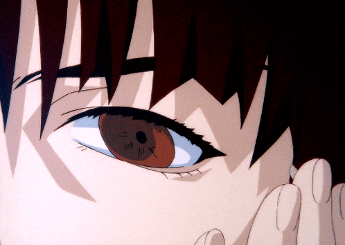 a close up of a person 's brown eye with a blue pupil