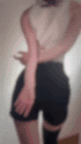 a blurry picture of a person wearing shorts