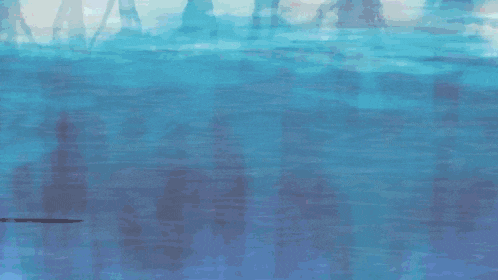 a person wearing a pair of pink shoes is walking on a blue surface