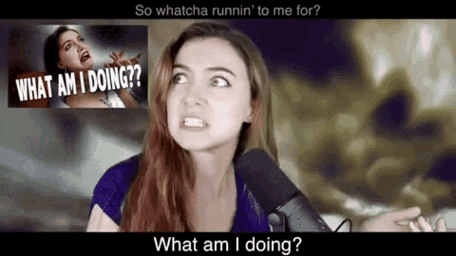 a woman is talking into a microphone with the words what am i doing on the screen behind her