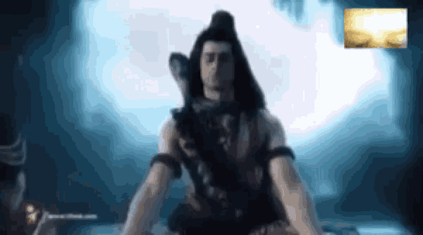 a close up of a man holding a sword in his hand