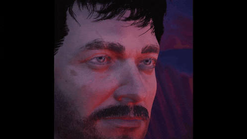 a close up of a man 's face with a beard and blue eyes .