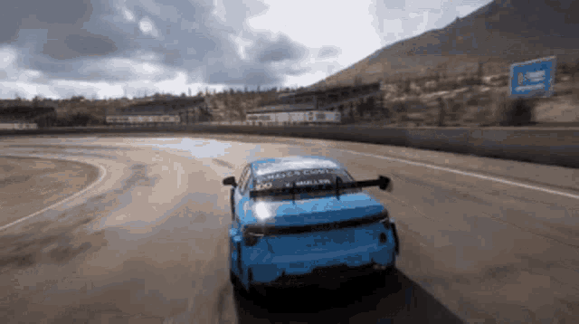 a blue race car with the word miller on the back of it