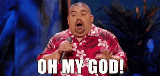 a fat man is holding a microphone and saying oh my god !