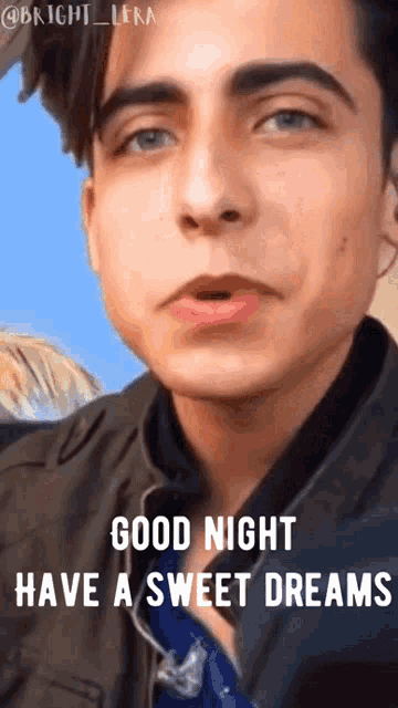 a close up of a man 's face with the words good night have a sweet dreams .