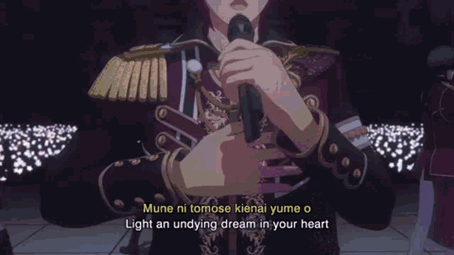 a man is singing into a microphone with the words light an undying dream in your heart