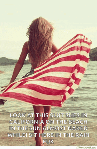 a picture of a woman holding a striped towel on the beach with the caption look at this slut shes in california on the beach