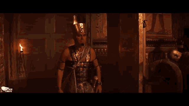 a man in a helmet is standing in a dark room and asking what are you doing here ?
