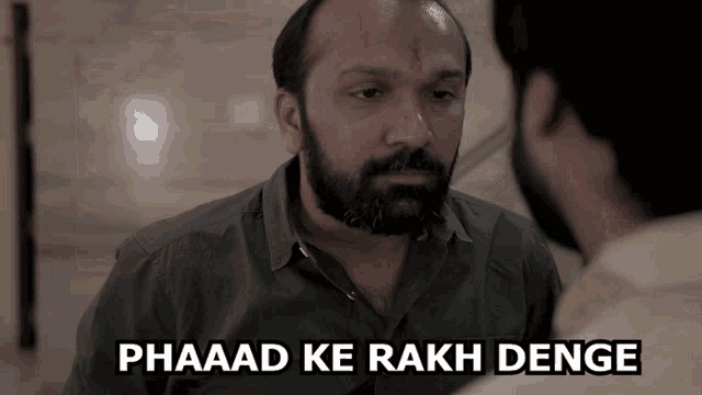 a man with a beard is talking to another man with the words phaad ke rakh denge above him