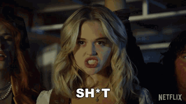 a blonde woman says sh * t in front of a netflix sign