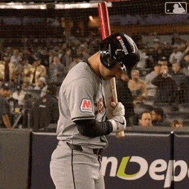 a baseball player wearing a helmet that says strauss