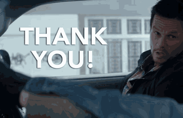 a man in a car with the words thank you written on the screen