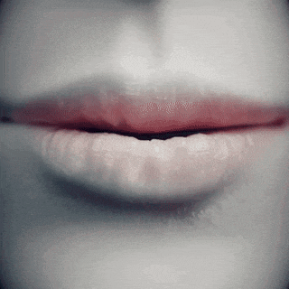 a close up of a woman 's lips with red lipstick on them