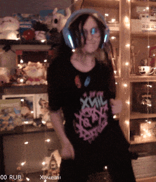 a person wearing headphones and a t-shirt that says xwil on it