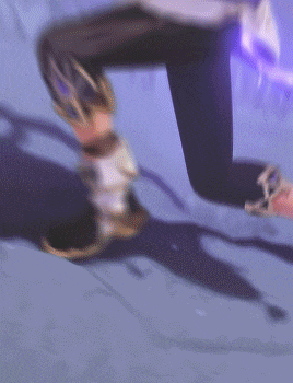 a person in a video game is flying through the air with purple lights behind them
