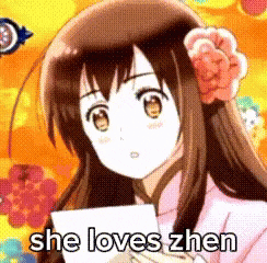 a girl is holding a piece of paper and saying `` she loves zhen '' .