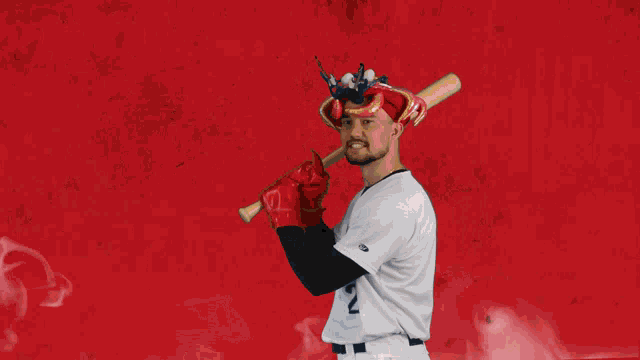 a man in a baseball uniform with the number 2 on it