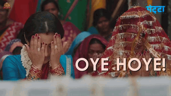 a group of women are covering their faces with their hands and the words oye hoye are visible