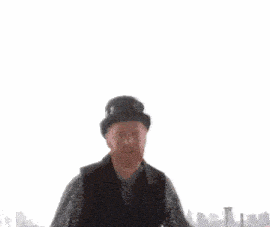 a man wearing a top hat with a clock on top of it