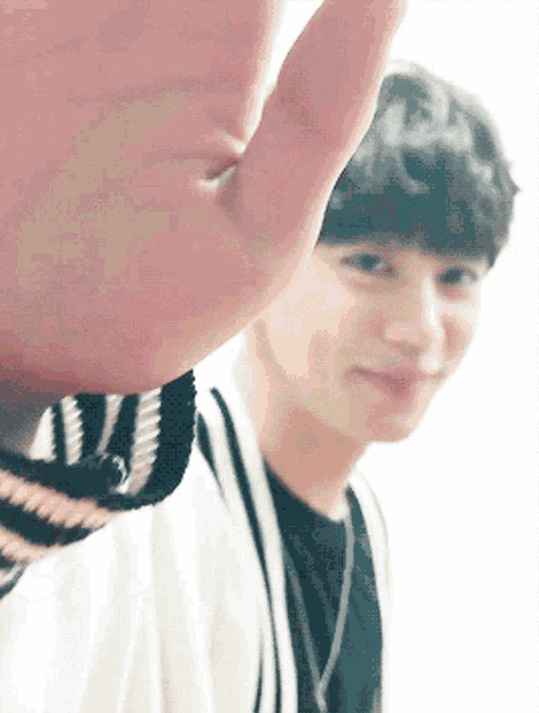 a close up of a person 's hand reaching out