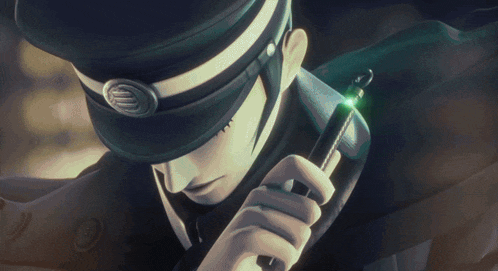 a man in a hat holds a green object