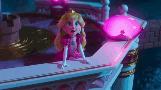 a princess peach doll is sitting on a balcony