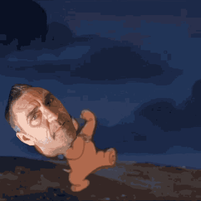 a man is standing in front of a cartoon drawing of a ghost