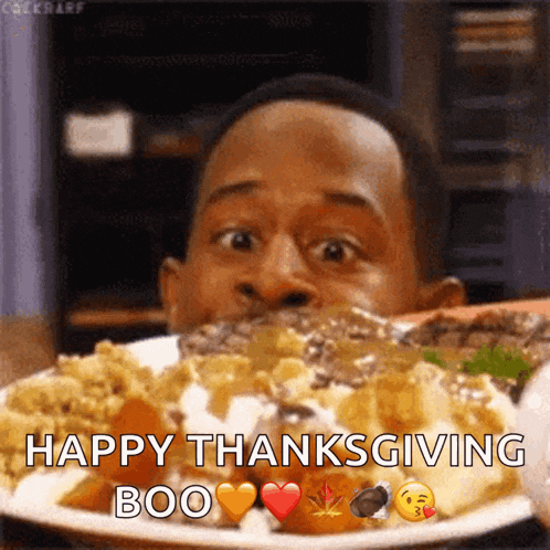 a man is eating a plate of food with the words happy thanksgiving boo on the bottom