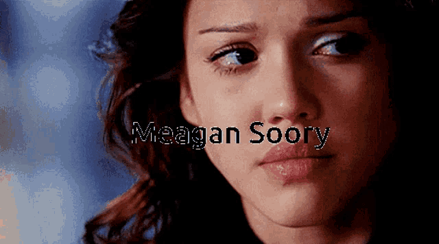 a close up of a woman 's face with the name megan soory written above her