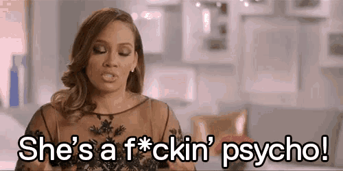 a woman in a black dress is talking and saying she 's a f * cking psycho !