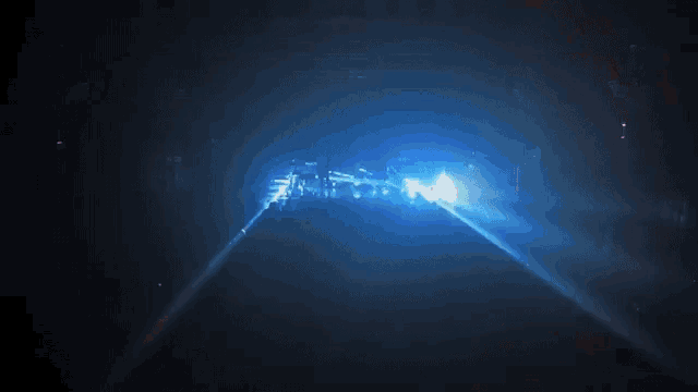 a dark room with a blue light coming out of it