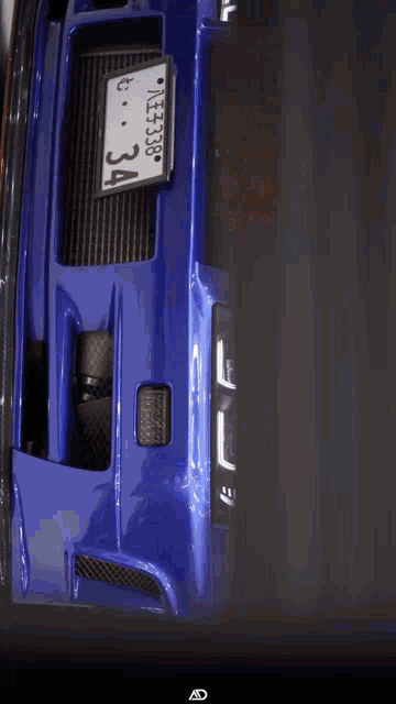 a blue car with a license plate that says kfz138 on it