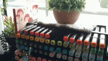 a bunch of markers are stacked on top of each other with the numbers 1 through 12 on the bottom
