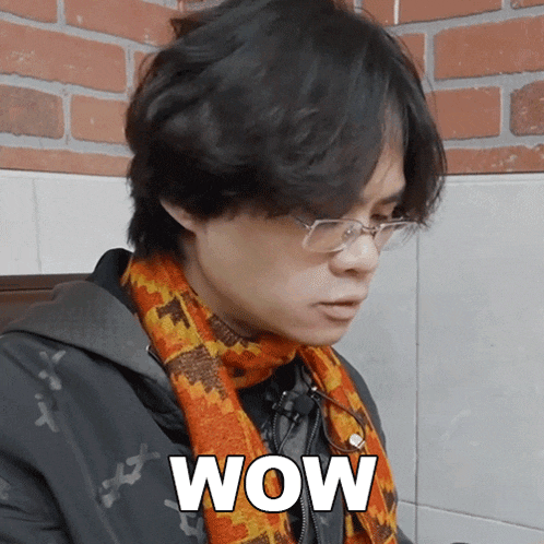 a man wearing glasses and a scarf with the word wow on it