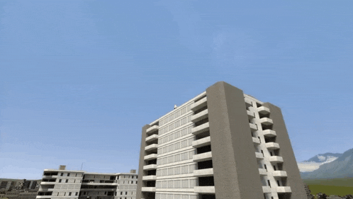 a large building with a blue sky behind it