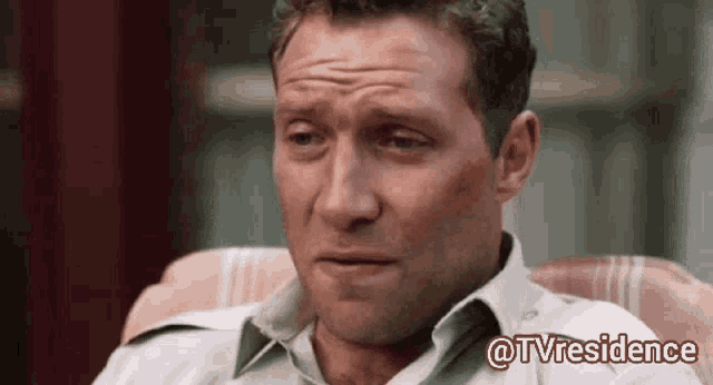 a man is sitting in a chair with a caption that says tvresidence