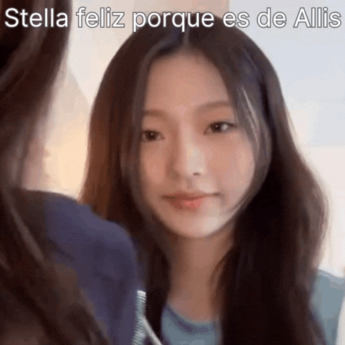 a girl with long hair is looking at another girl .