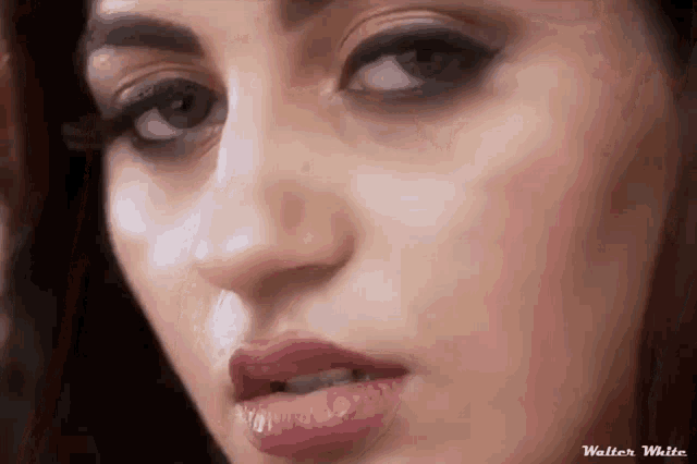 a close up of a woman 's face with walter white written in the corner .