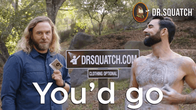 two men standing next to a sign that says drsquatch.com on it